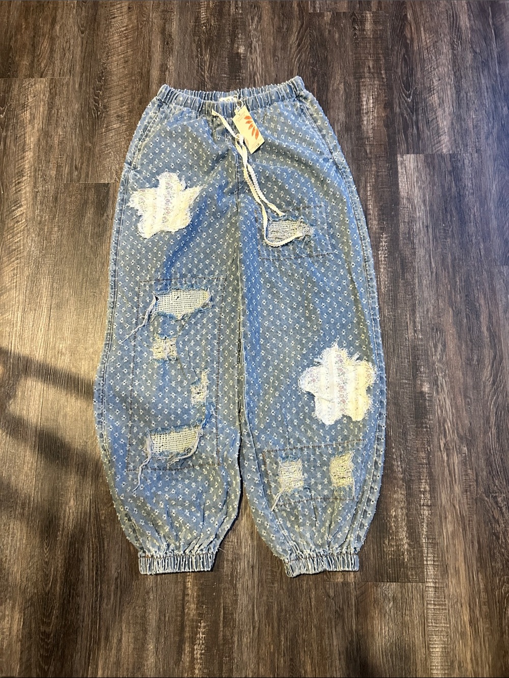 Attire Access Light Blue Distressed Track Pants with White Patch Details